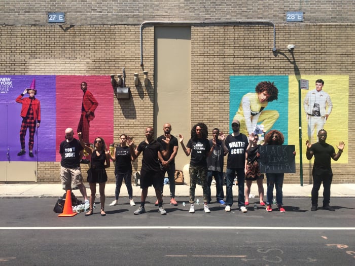 The silent protest taking place outside the venue on Washington Street. Photo: Karina Hoshikawa/Fashionista