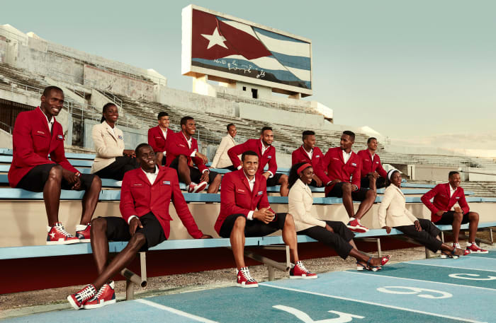 Cuban Athletics Team Members at Estadio Panamericano beneath Cuban National flag in Havana, Cuba. Photo: Rene Habermacher