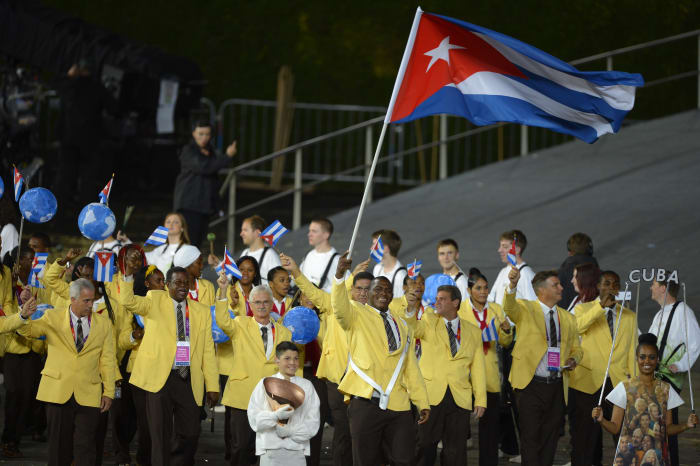 Cuba's flagbearer Mijain Lopez Nunez leads the Cuban delegation during the opening ceremony of the London 2012 Olympic Games Photo: Odd Andersen/AFP/Getty Images