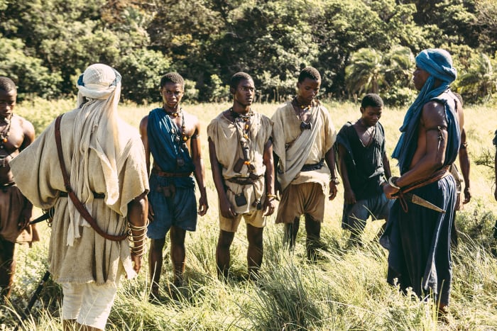 "The costumes needed to be harmonious, and interesting by their color relationships and beauty," says Carter. Kunta Kinte (Malachi Kirby, center) in a scene from "Night One." Photo: History Channel/Roots