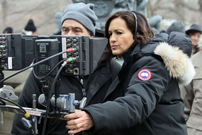 Det. Benson, er, Mariska Hargitay stays warm in her Canada Goose parka while behind the camera. Photo: Canada Goose