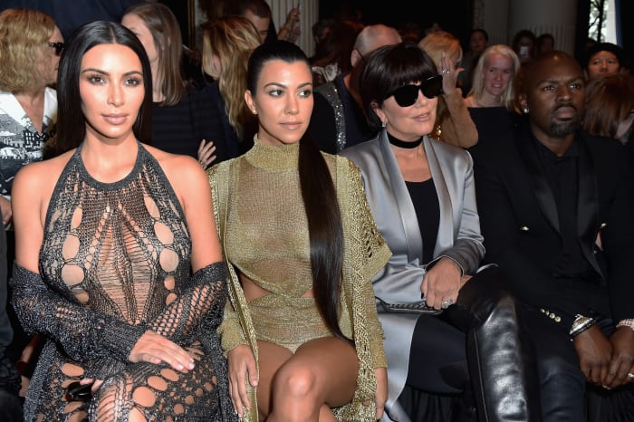 Kim Kardashian, Kourtney Kardashian, Kris Jenner and Corey Gamble at the Balmain spring 2017 show during Paris Fashion Week. Photo: Pascal Le Segretain/Getty Images