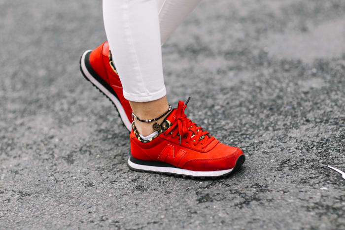 A pair of (coincidentially) red New Balance shoes spotted on the street in Ho Chi Minh City, Vietnam. Photo: Edward Berthelot/Getty Images