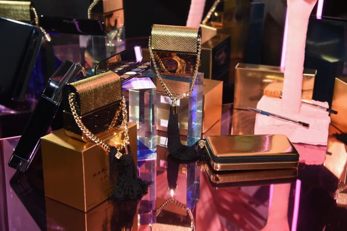 Various Marc Jacobs fragrances, dripping in gold. Photo: Jamie McCarthy/Getty Images for Marc Jacobs
