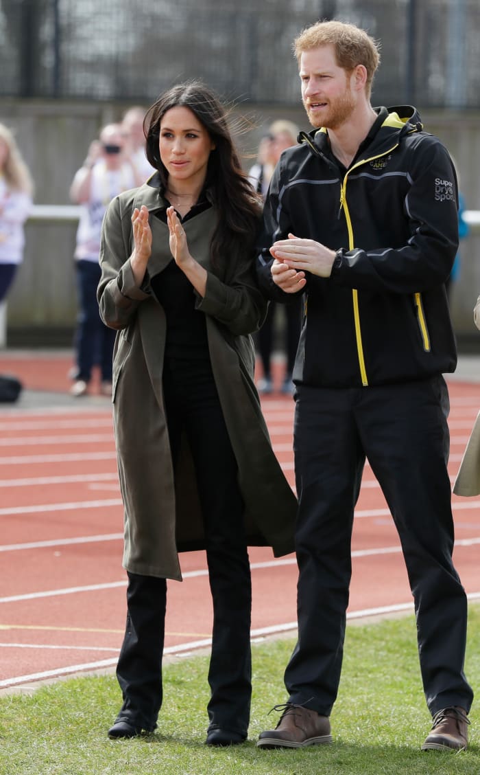 Prince Harry and his fiancee Meghan Markle applaud as they attend the U.K. Team Trials for the Invictus Games Sydney 2018 at the University of Bath Sports Training Village. Photo: Kirsty Wigglesworth /Getty Images