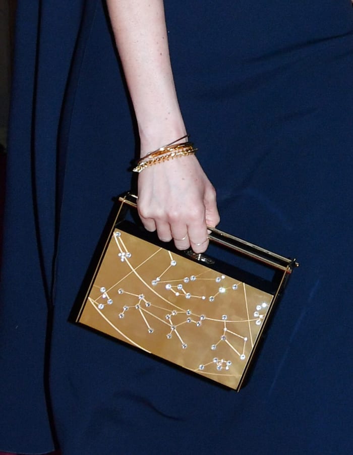 A close-up look at Meghan Markle's Naeem Khan Zodiac clutch. Photo: John Stillwell - WPA Pool/Getty Images