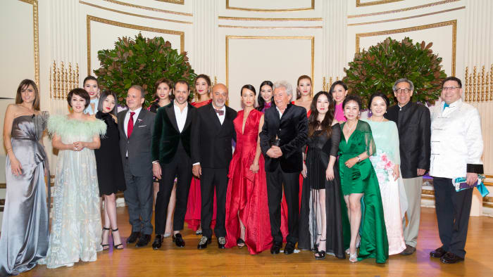 Honorees and VIP guests, including Yue-Sai Kan (second from left), Massimiliano Giornetti (starting fifth from left), Christian Louboutin, Maggie Q, Alessandro Bastagli and Grace Chen. Photo: Courtesy