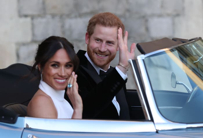Meghan Markle and Prince Harry depart for their evening wedding reception. Photo: STEVE PARSONS/AFP/Getty Images