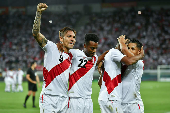 Peru's forward Paolo Guerrero (left) celebrates with teammates after scoring his team's third goal during a Saudi Arabia vs. Peru match earlier this month in Switzerland. Photo: Fabrice Coffrini/AFP/Getty Images
