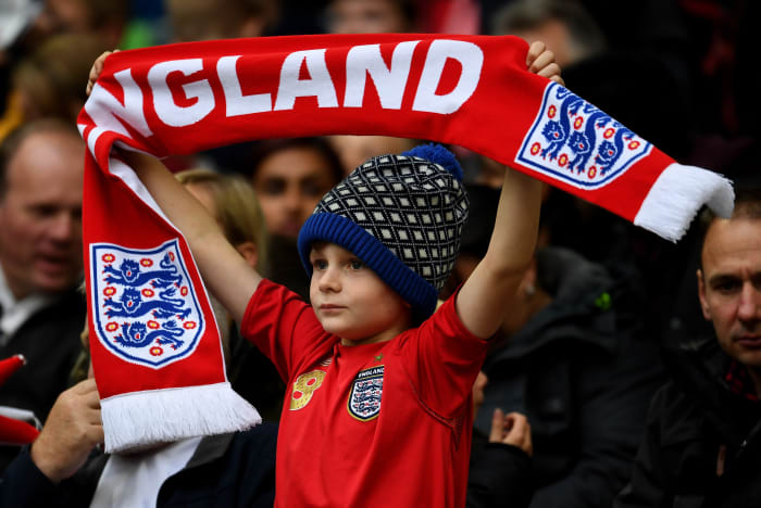 A young England fan cheers on his team during a 2018 FIFA World Cup qualifier match in Oct. 2016 in London. Photo: Mike Hewitt/Getty Images