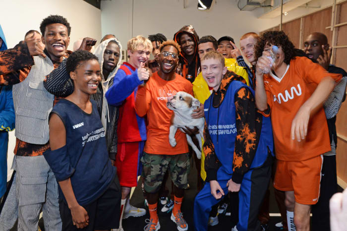 Tinie Tempah poses with models backstage at What We Wear's Spring 2019 show. Photo: David M. Benett/Dave Benett/Getty Images