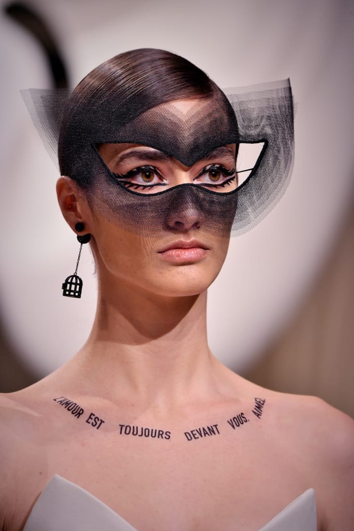 The cat-eye look Philips created in collaboration with milliner Stephen Jones. Photo: Pascal Le Segretain/Getty Images