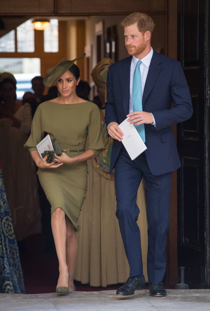 The Duchess of Sussex in a Ralph Lauren dress, Stephen Jones hat and Manolo Blahnik shoes with the Duke of Sussex. Photo: Dominic Lipinski - WPA Pool/Getty Images