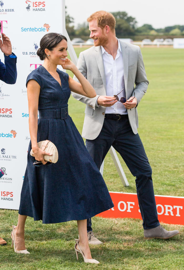 Duchess of Sussex Meghan Markle in Carolina Herrera with Duke of Sussex Prince Harry during the 2018 Sentebale polo match on Thursday in Windsor, England. Photo: Samir Hussein/Samir Hussein/WireImage