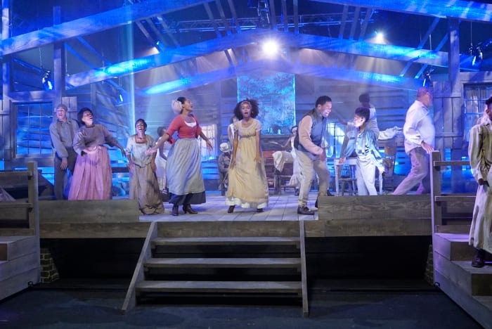 Junior (Marcus Scribner), Ruby (Jenifer Lewis), Diane (Marsai Martin), Rainbow (Tracee Ellis Ross), Zoey (Yara Shahidi), Dre (Anthony Anderson), Jack (Miles Brown) and Pops (Laurence Fishburne), with choir members in the background. Photo: ABC/Kelsey McNeal