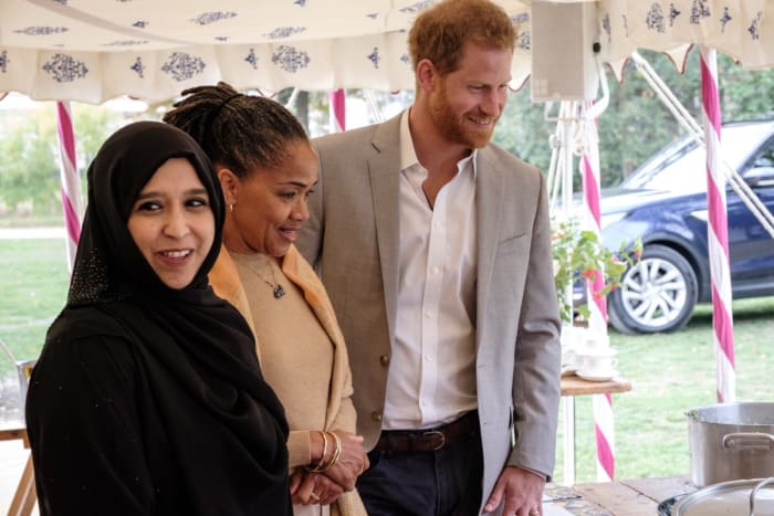 A member of the Hubb Community Kitchen with Doria Ragland and Prince Harry. Photo: @KensingtonRoyal/Twitter