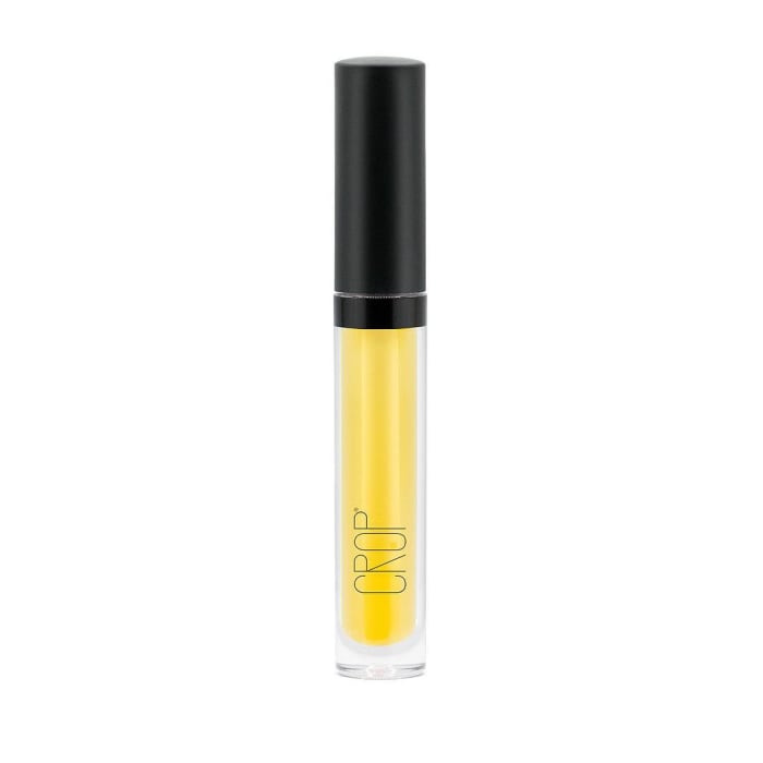 Crop Natural's Smooth Glide Lip Gloss, which appears yellow in the tube (but goes on clear) because of the vegetable and plant oils in the formula. Photo: @cropnatural/Instagram
