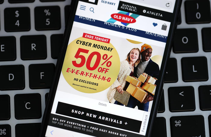 In this photo illustration, a Cyber Monday ad for Old Navy. Photo Illustration: Justin Sullivan/Getty Images