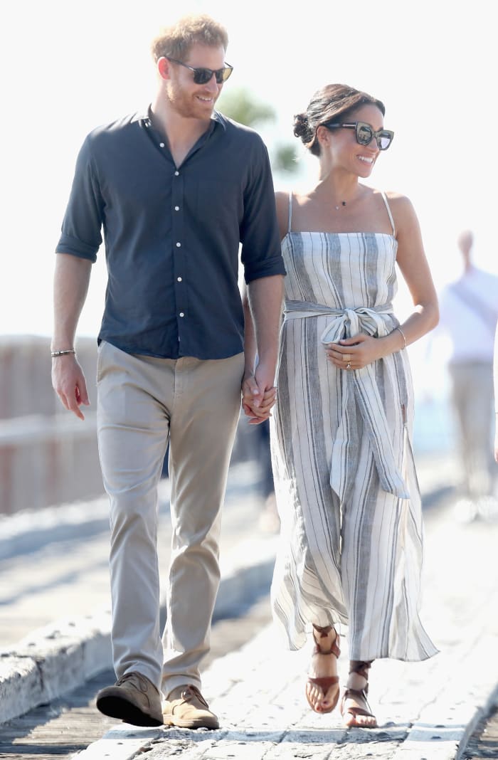 Prince Harry and Meghan Markle (in Reformation) walking along Kingfisher Bay Jetty in Fraser Island, Australia. Photo: Chris Jackson/Getty Images