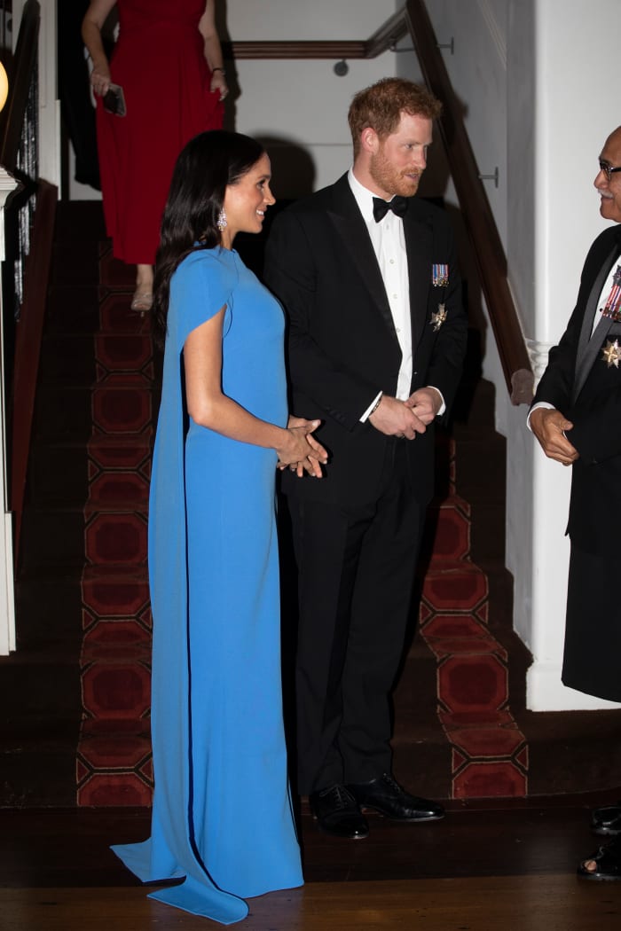 Meghan Markle in Safiyaa and Prince Harry at a state dinner in Suva, Fiji. Photo: Ian Vogler - Pool/Getty Images