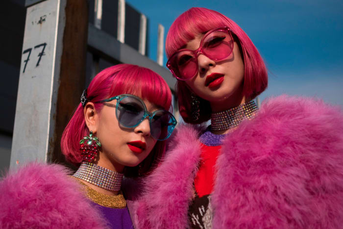 Showgoers outside Gucci's Fall 2018 runway show during Milan Fashion Week. Photo: Marco Bertorello/AFP/Getty Images