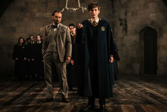 Tweedy Dumbledore and a young Newt (Joshua Shea) at Hogwarts. Jaap Buitendijk/Courtesy of Warner Bros. Pictures