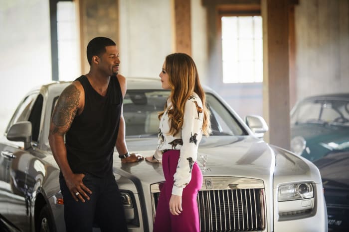 Michael Culhane (Robert Christopher Riley) probably in a designer tank top and Fallon, in a Stella McCartney shirt, enjoy a private moment. Photo: Bob Mahoney/The CW