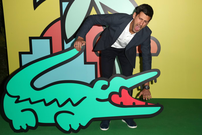 Novak Djokovic with a M/M Paris-designed cardboard crocodile at a party to celebrate the Beverly Hills store reopening in November. Photo: Frederick M. Brown/Getty Images
