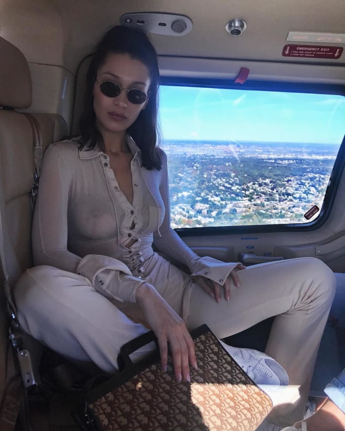 Bella Hadid carries a monogrammed Dior bag in October 2017. Photo: Instagram/@bellahadid