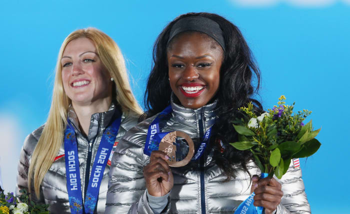Bronze medalists Jamie Greubel and Aja Evans of the United States team 2 celebrate during the medal ceremony for the Women's Bobsleigh at the 2014 Winter Olympics in Sochi. Photo: Photo by Alexander Hassenstein/Getty Images