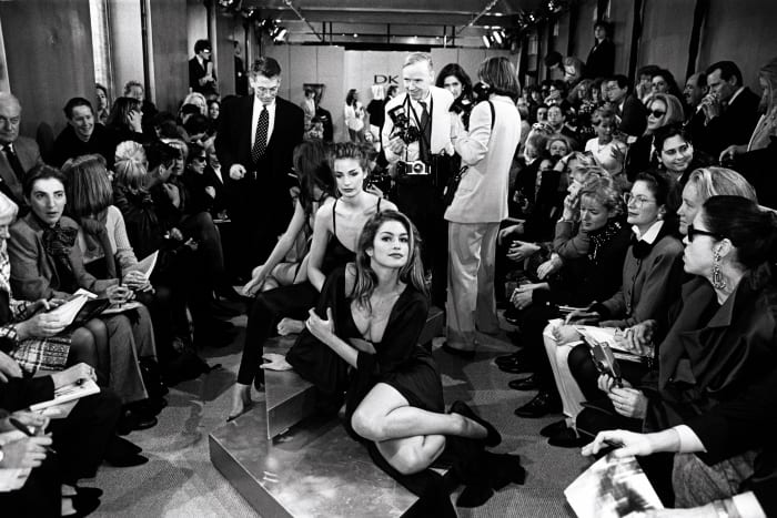 Cindy Crawford reclines on the runway at Donna Karan's Fall 1992 show, April 1992. Photo: George Chinsee/Penske Media/REX/Shutterstock