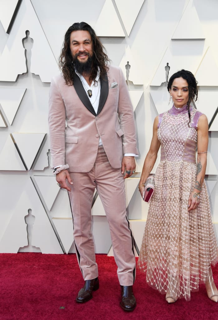 Jason Momoa (and his scrunchie) and Lisa Bonet in custom Fendi at the 2019 Oscars. Photo: Frazer Harrison/Getty Images