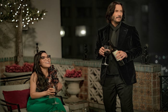 "We had a lot of conversations where we're like, 'We're lost now. Is it the real Keanu or the actor playing Keanu?'" says Evans. Sasha in an Isabel Marant top and Keanu Reeves in "head-to-toe" Tom Ford. Photo: Doane Gregory/Netflix