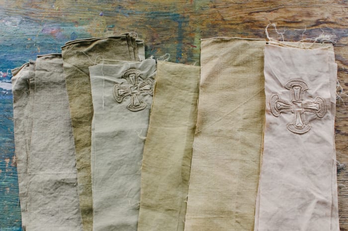 Old altar cloths Brother Aidan colored with natural dyes made from avocado pits and onion skins to be used as part of a quilt project. Photo: Whitney Bauck/Fashionista