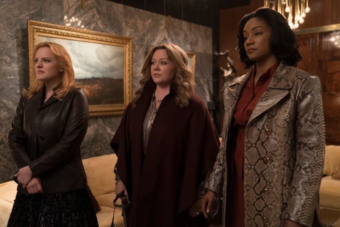 Claire (Elisabeth Moss), Kathy (Melissa McCarthy) and Ruby (Tiffany Haddish) dress for the job they want. Photo: Alison Cohen Rosa/Courtesy of Warner Bros. Entertainment