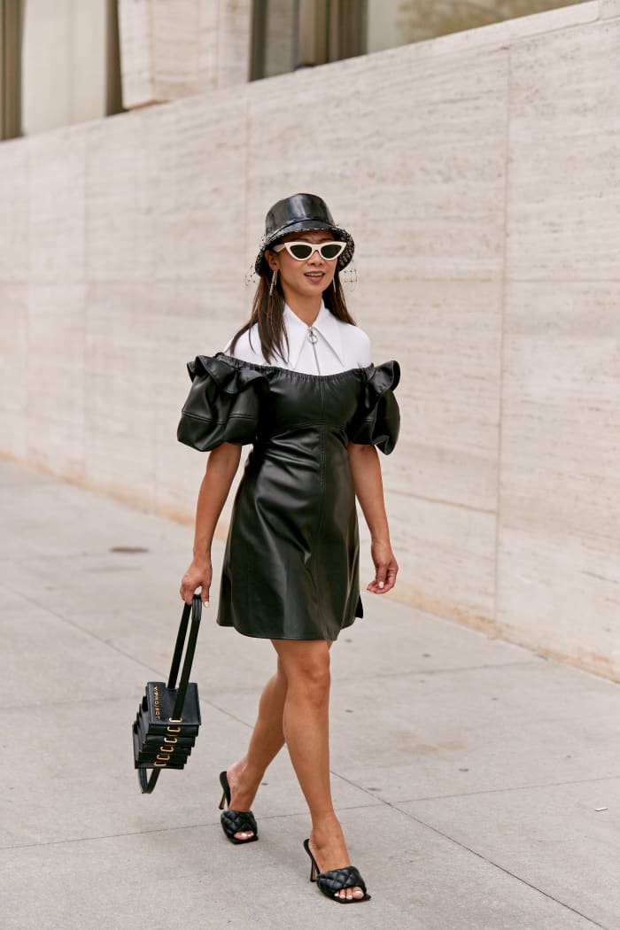 A showgoer wearing Bottega Veneta's quilted leather mules on the street at New York Fashion Week Spring 2020. Photo: Imaxtree 