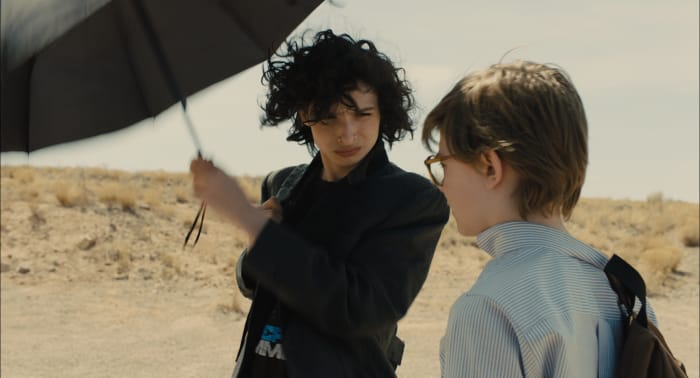 Boris (Finn Wolfhard) and Theo in his Brooks Brothers shirt from the Barbours. Photo: Macall Polay/Courtesy of Warner Bros. Pictures