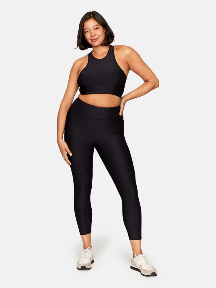 Outdoor Voices Athena Crop Top, $45, available here, and 3/4 Warmup Leggings, $75, available here.