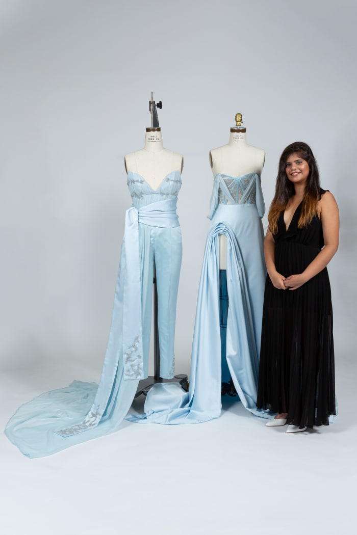 Ashna Moogi, a fashion design student at the Fashion Institute of Technology, with her winning garments designed for Elsa from 'Frozen.' Photo: Courtesy of FIT