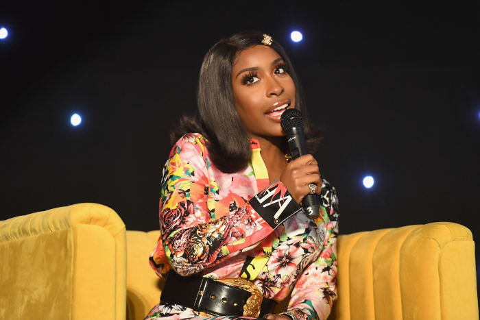 Jackie Aina speaks onstage during the 2019 Essence Beauty Carnival on April 28, 2019 in New York City. Photo: Paras Griffin/Getty Images