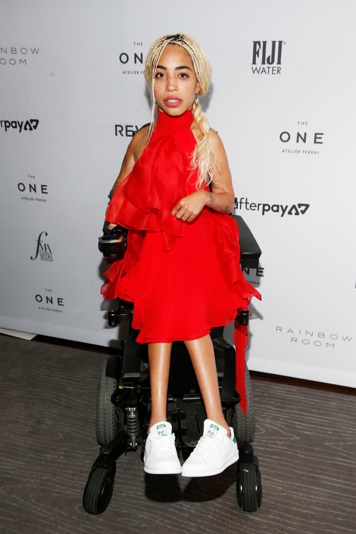 Mercado at the 2019 Daily Front Row Fashion Media Awards, wearing Redemption Official and Adidas.