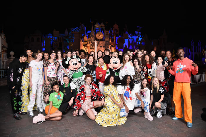 The designers with Mickey and Minnie Mouse, plus all the models after their show celebrating Opening Ceremony's collection in honor of Mickey's 90th anniversary in Anaheim, California.