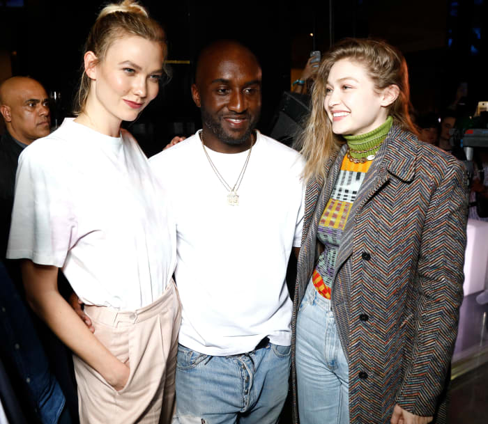 Karlie Kloss, Virgil Abloh and Gigi Hadid at the launch of Evian and Virgil Abloh's limited-edition "One Drop can make a Rainbow" during Paris Fashion Week. Photo: Julien M. Hekimian/Getty Images for EVIAN