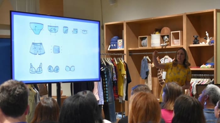 Caitlin Roberts explaining KonMari folding techniques at The RealReal. Photo: Courtesy of The RealReal