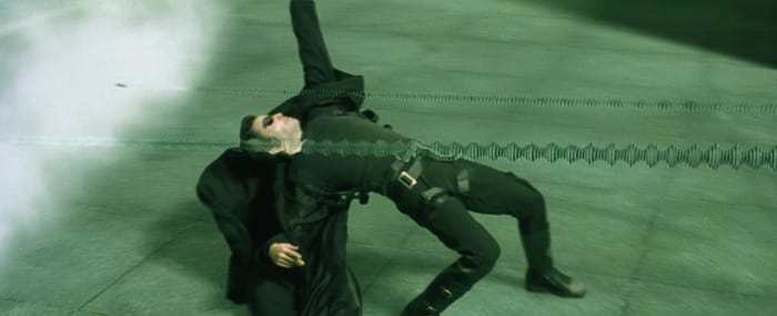 Barrett also says "a lot of really big fans" and the perfect lightweight wool blend helped create the now-iconic billowing effect of Neo's coat in the Bullet Time sequence. Photo: Screengrab/The Matrix