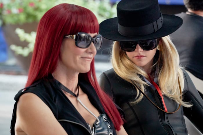 Laura Albert as Speedie in Haider Ackermann vest and vintage and Savannah Knoop as J.T. in a Gladys Tamez Millinery hat and Abysse wetsuit jacket at Cannes. Photo: Courtesy of Universal Pictures Content Group