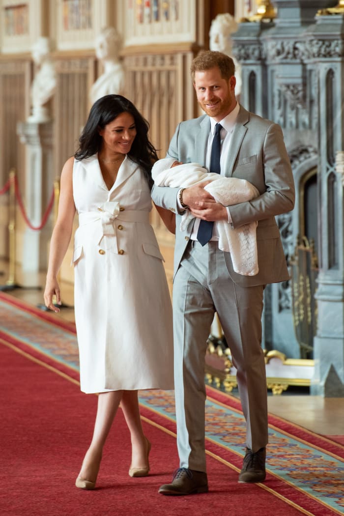 Meghan, Duchess of Sussex, in Wales Bonner, and Prince Harry, Duke of Sussex, with their newborn son in St George's Hall at Windsor Castle. Photo by Dominic Lipinski - WPA Pool/Getty Images