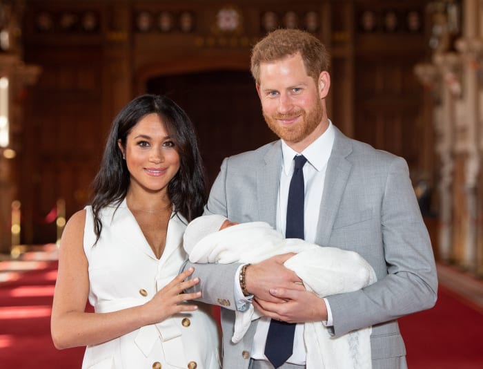 Meghan, Duchess of Sussex, in Wales Bonner, and Prince Harry, Duke of Sussex, with their newborn son in St George's Hall at Windsor Castle. Photo by Dominic Lipinski - WPA Pool/Getty Images