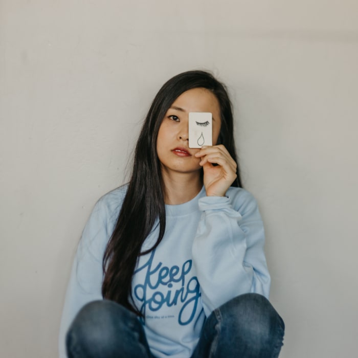 Self-Care Is for Everyone's "Keep Going" sweatshirt, supporting the American Foundation for Suicide Prevention.