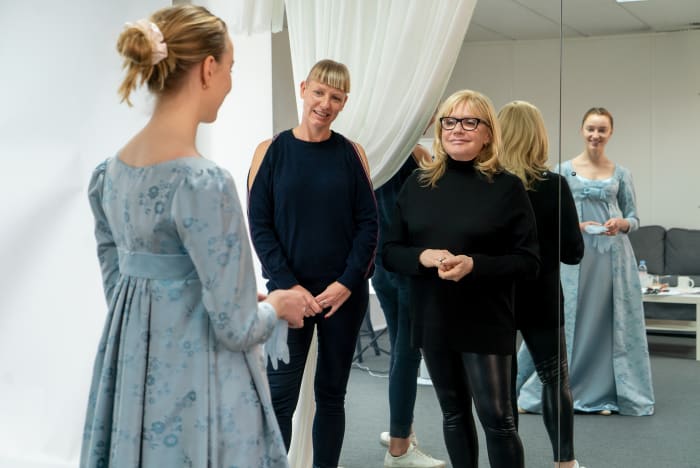 "This was the vast the most vast show I've ever done in my entire career and the most fabulous show I’ve ever done in my entire career," says Mirojnick, at right, fitting Dynevor.